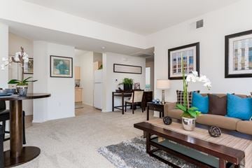 San Diego apartment for rent - A living room with a brown couch and a coffee table.