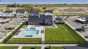 Eagle townhouse for rent - A large building with a pool in front of it.