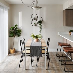 Vancouver apartment for rent - a dining area with a wooden table and black and white chairs