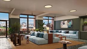 New York apartment for rent - A modern living room with a large window overlooking the city.
