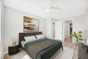 Las Vegas apartment for rent - a bedroom with a large bed and a large painting on the wall