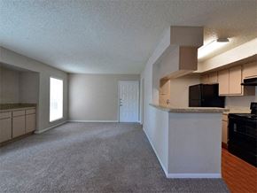 Houston apartment for rent - Unfurnished model home living room with view of kitchen