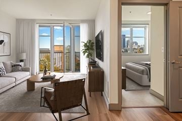 Seattle apartment for rent - A living room with a brown chair and a white couch.