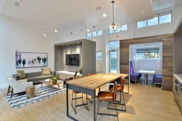 Berkeley apartment for rent - A modern living room with a wooden table and chairs.