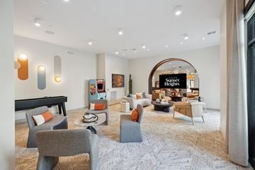 Houston apartment for rent - A living room with a pool table and a sign that says "St. Regis Heights".