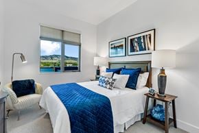 Boulder apartment for rent - A bedroom with a large bed and a chair.