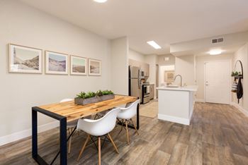 Wide-plank wood flooring throughout living, dining and kitchen areas*