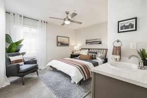 Wilsonville apartment for rent - Bedroom with en suite sink and ceiling fan at Canyon Creek Apartments, Wilsonville, OR