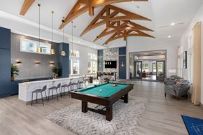 Charleston apartment for rent - A room with a pool table and a bar area.