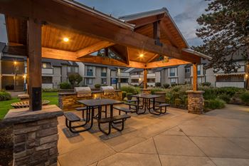 Covered outdoor pavilion with grills and picnic tables