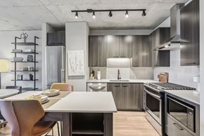Chicago apartment for rent - A modern kitchen with a dining table and chairs.