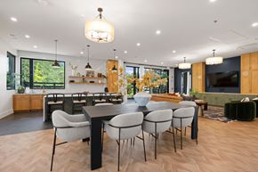 Mcdonough apartment for rent - A modern dining room with a large table and chairs.