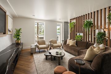 San Diego apartment for rent - A living room with a brown couch and a coffee table.