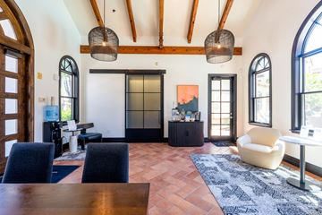 San Jose apartment for rent - A living room with a wooden table and chairs.