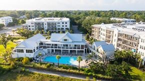 Mtpleasant apartment for rent - A large white building with a pool in front.