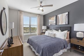 Gilbert apartment for rent - a bedroom with a bed and a ceiling fan