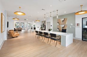 Fontana apartment for rent - A modern office space with wooden floors and furniture.