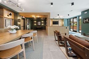 Raleigh apartment for rent - A modern dining room with a long table and chairs.