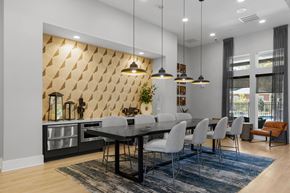 Raleigh apartment for rent - A modern dining room with a large table and chairs.