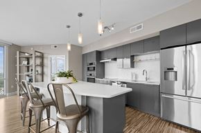 Charlotte apartment for rent - a kitchen with stainless steel appliances and a white counter top