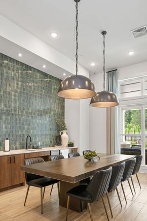 Raleigh apartment for rent - A modern dining room with a large table and chairs.