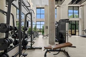 Charlotte apartment for rent - A gym with a row of dumbbells and a bench.