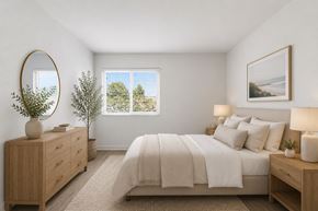 La Mesa apartment for rent - A spacious bedroom with a large bed, a dresser, and a window.