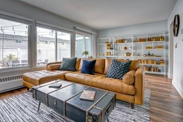 Alameda apartment for rent - a living room with a brown couch and a coffee table