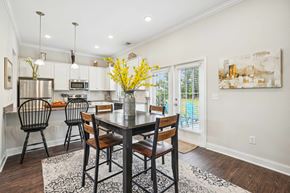 Myrtle Beach apartment for rent - a dining room with a table and chairs and a kitchen