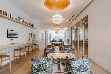 Nashville apartment for rent - A modern living room with a long table and chairs.