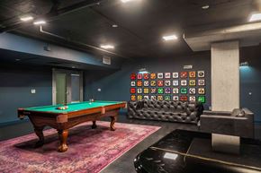 San Francisco apartment for rent - A pool table with a green cloth and a cue stick on it.