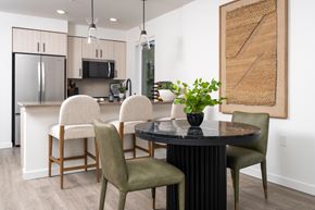 Woodinville apartment for rent - A modern dining room with a round table and chairs.