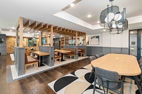 Charlotte apartment for rent - A modern dining area with a wooden table and chairs.