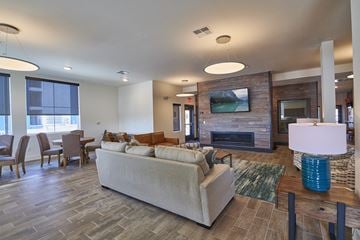 Colorado Springs apartment for rent - a living room with a couch and a fireplace