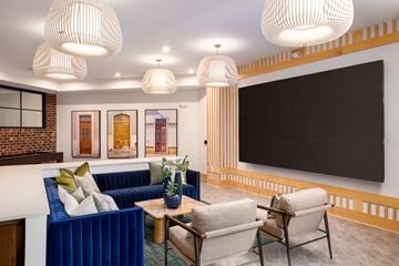 Nashville apartment for rent - A living room with a blue couch and a coffee table.
