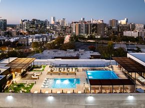 Nashville apartment for rent - A rooftop pool area with a city skyline in the background.