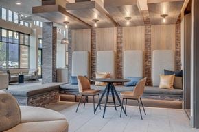 Salt Lake City apartment for rent - A modern dining area with a wooden table and chairs.