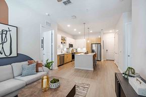 Longwood apartment for rent - A modern kitchen with a dining table and chairs.