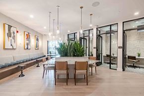 Longwood apartment for rent - A modern dining room with a long table and chairs.