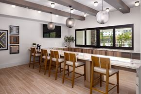 Fairburn apartment for rent - A dining room with a long table and chairs.