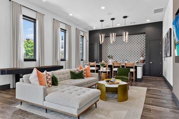 Bastrop apartment for rent - A modern living room with a grey sofa and a coffee table.