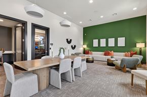 Bastrop apartment for rent - A modern dining room with a wooden table and grey chairs.