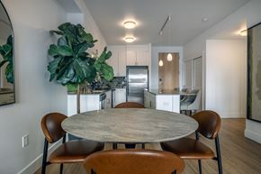 Seattle apartment for rent - A modern dining room with a large table and chairs.