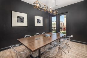 Atlanta apartment for rent - A dining room with a wooden table and chairs.