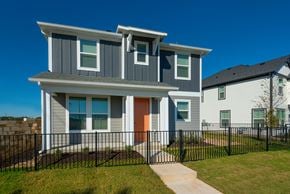 Leander apartment for rent - A modern house with a grey and white exterior and an orange door.