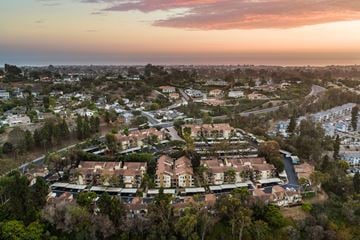 Carlsbad apartment for rent - A residential area with houses surrounded by trees.