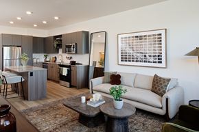 Hillsboro apartment for rent - A modern kitchen with a dining table and a couch.