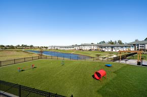 Huntsville apartment for rent - A playground with a blue pool and red and blue play structures.