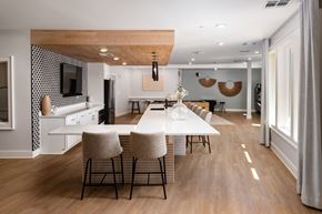 Huntsville apartment for rent - A modern dining room with a long table and chairs.