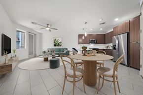 Tempe apartment for rent - A modern kitchen with a dining table and chairs.